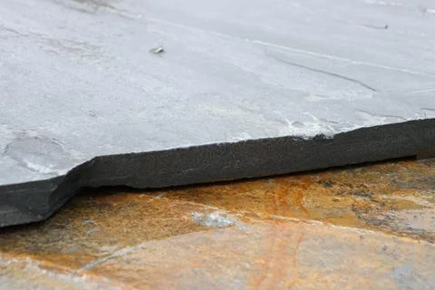 A closeup view showcasing the intricate texture and edge of a natural slate Stock Photos