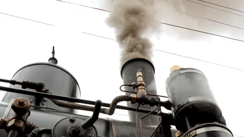 A closeup view showcasing the smoke produced by an aged industrial steam Video stock 280314815
