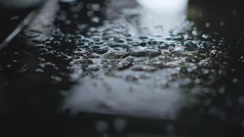 A closeup view showcasing water droplets beautifully resting on a surface Stock Footage 309421630