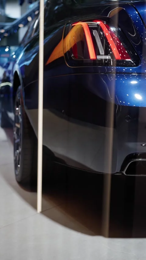 CloseUp View of a Sleek and Stylish Blue Sports Car at an Exciting Auto Show Stock Footage 318967346
