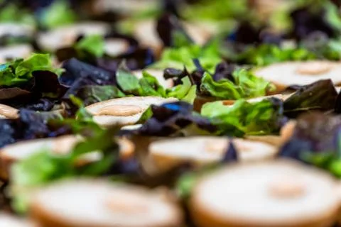 Closeup View of Sliced Bread Spread on the Table with Lettuce on them Stockfoto's