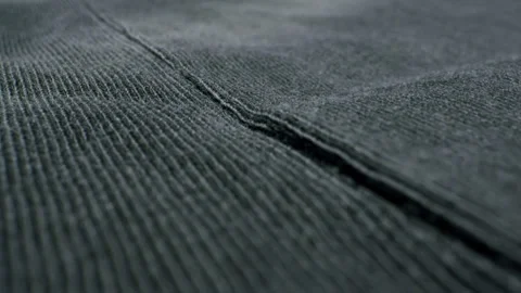 A closeup view of soft textured fabric in a deep, dark color with rich details Stock Footage 281023706