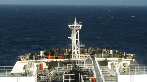Closeup view of splash of a sea wave against a bow with great sprays and rainbow Stock Footage 120122064