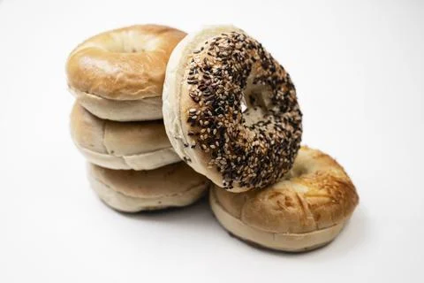 Closeup view of stack collection of bagel breads with various kind isolated.. Stock Photos