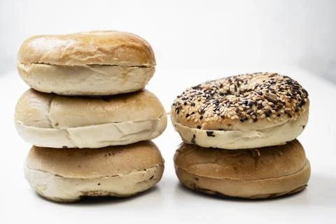 Closeup view of stack collection of bagel breads with various kind isolated.. Stock Photos