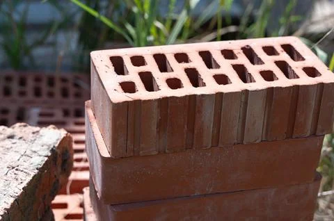 A closeup view of stacked bricks elegantly displays their intricate design an Stockfoto's