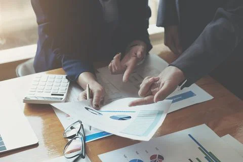 Closeup view of teamwork proccess.People hands, holding report paper documents Stock Photos