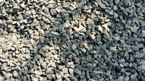 Closeup view of a textured gravel surface with various shades of gray and u.. Stock Footage 339295876