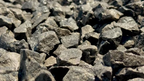 Closeup view of textured gray stones with sunlight highlighting rough surfa.. Stock Footage 339296079