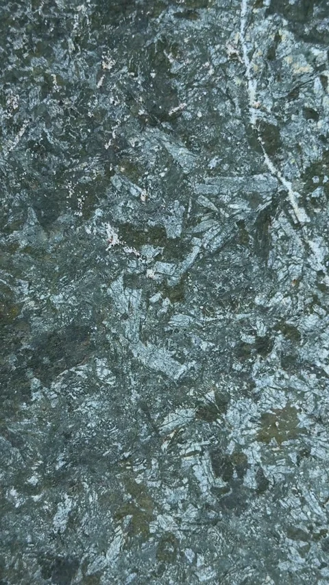 Closeup view of textured green stone surface with intricate natural pattern.. Stock Footage 338414347