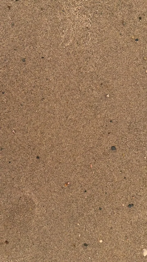 Closeup view of textured sandy surface with subtle patterns and natural ear.. Video stock 338414349