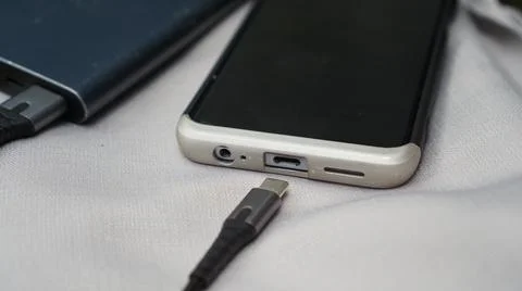 Closeup View of type c port of phone with the powerbank and cable. 스톡 사진