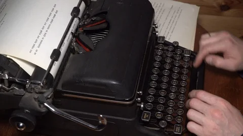 Closeup view of typing text typewriter and carriage return mans hands russian Видео 129403087