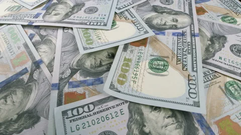 A CloseUp View of U.S. Dollar Bills Neatly Piled Together in a Stack or Formatio Stock Footage 303572049