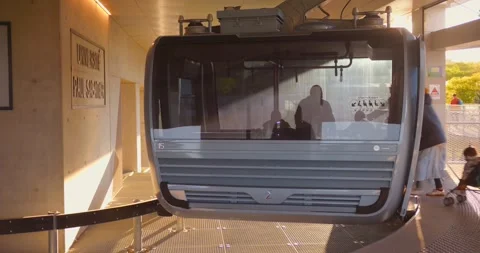 Closeup view of vacant cable car halted for passengers to get boarded at Stock Footage 313739732