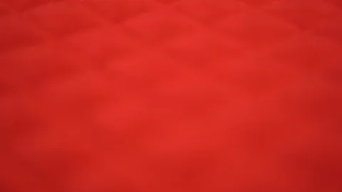 Closeup view video of blurry defocused bright red quilted texture of fabric Stock Footage 129151373