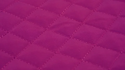 Closeup view video of bright pink quilted texture of fabric. Stock Footage 129151637