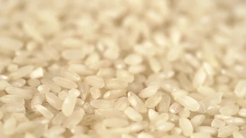 Closeup view video of white uncooked rice rotating Stock Footage 125621676