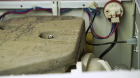 Closeup view of washing laundry machine excessive drum vibration internals Video stock 130473751
