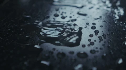A CloseUp View of Water Droplets on a Dark Surface Showcasing Their Intricate Video stock 313285551