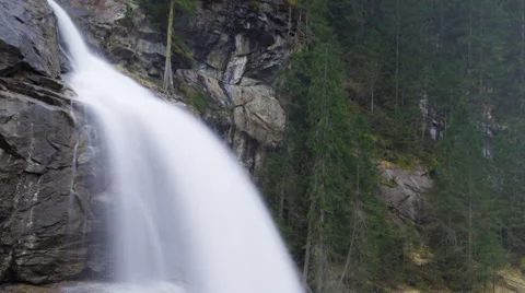 Closeup view of water falling down to rocks. Timelapse panning down video Stock Footage 61535601