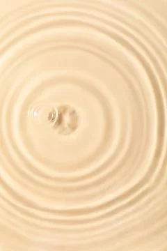 Closeup view of water with rippled surface on beige background 写真素材