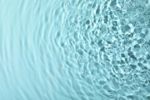 Closeup view of water with rippled surface on light blue background 写真素材