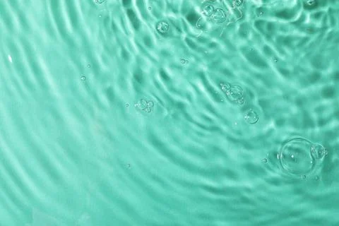 Closeup view of water with rippled surface on light blue background 写真素材