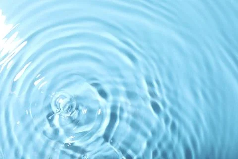 Closeup view of water with rippled surface on light blue background 写真素材