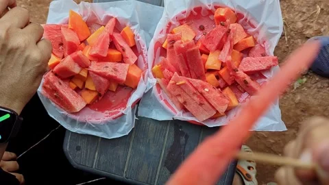 Closeup view of watermelon slices served on plate at roadside shop during s.. Stock Footage 335880488