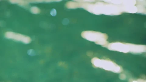 Closeup view watery sparkling surface in summer sunny day. Unfocused turquoise Stock Footage 102877953