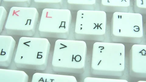 Closeup view of white computer keyboard highlighting alphabet Stock Footage 165690932