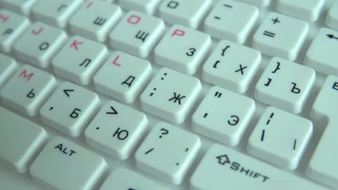 Closeup view of white computer keyboard highlighting alphabet Stock Footage 165690933