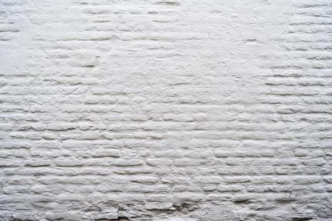 Closeup view of the white wall. Abstract pattern of a brick wall Stock Photos