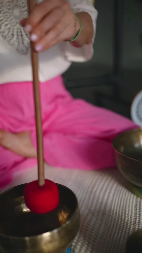 Closeup view of woman using singing bowls in sound healing therapy indoors. Stock Footage 276957756