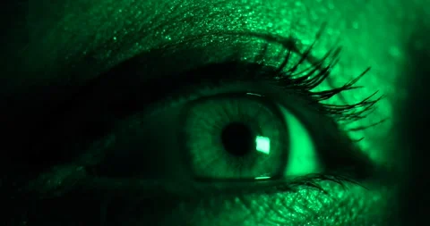 Closeup view of woman's opening beautiful eye in dark blinking neon light. Stock Footage 147347926