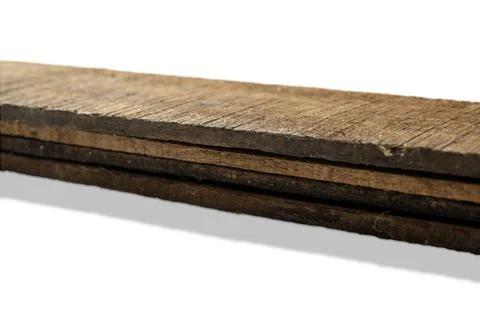 Closeup view of wood plank stack isolated over white background. Natural wo.. Stock Photos