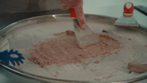 Closeup view of worker preparing fresh ice cream during working day in Stock Footage 148008136