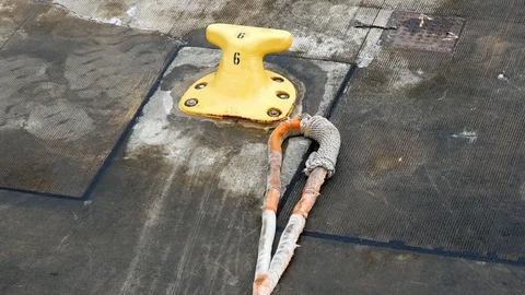 Closeup view of yellow Iron pole for mooring ships. Stock-Footage 121460836