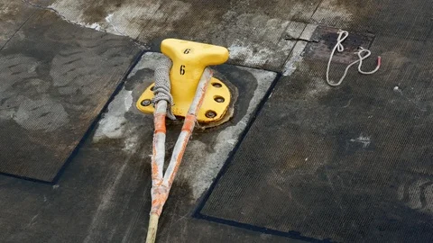 Closeup view of yellow Iron pole for mooring ships. Stock-Footage 121461178