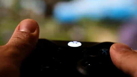 Closeup view of young guy hands playing game on console,videogame addiction Stock Footage 127107820