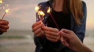 Closeup View Of Young People Holding Bengal Lights During Evening Standing  Stock Footage
