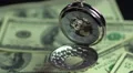 Closeup of vintage pocket watch hanging above money, precious time passing by HD Footage