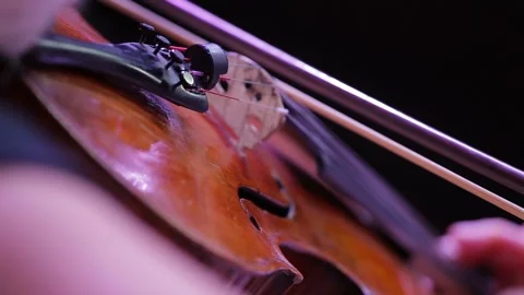 Closeup of a violin and hand with a bow. Symphony Orchestra. Violinists Stock-Footage 165942013