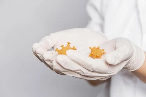 Closeup virus mock up in doctor's hands, concept of scientific research Stock Photos