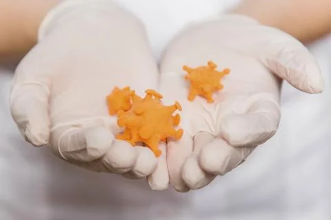 Closeup virus mock up in doctor's hands, concept of scientific research Stock Photos