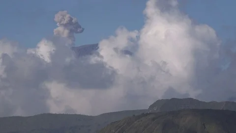 Closeup of a volcano puffing grey smoke near Mount Bromo in East Java, Indonesia Stock Footage 78430848