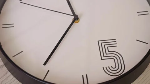 Closeup Wall Clock Face Showing Five, Black Hands Moving Toward Numeral Stock-Footage 330396185