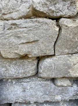 Closeup of wall made by stone with selective focus on foreground Foto stock