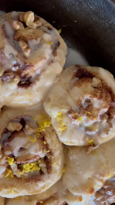 Closeup of walnut cinnamon rolls vertical Stock Footage 247663418